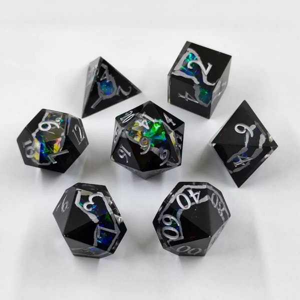 In-stock black sharp-edge resin dice with a rainbow dichroic foil vein and silver numbers