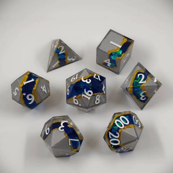 In-stock silver and blue sharp-edge resin dice with a gold vein and white numbers