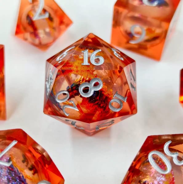 In-stock orange sharp-edge resin dice with a dichroic nebula core and silver numbers