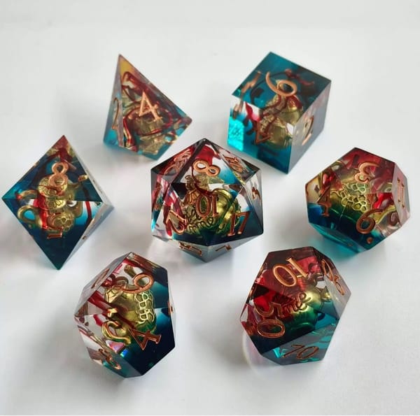 In-stock sharp-edge resin dice in teal and red with copper numbers
