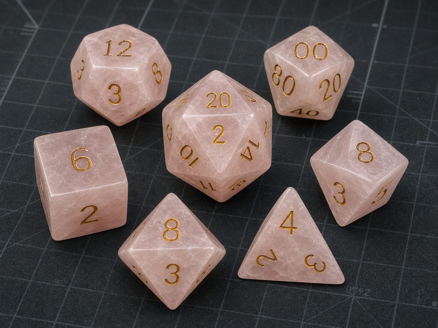 Natural rose quartz gemstone polyhedral dice packaged as a premium set